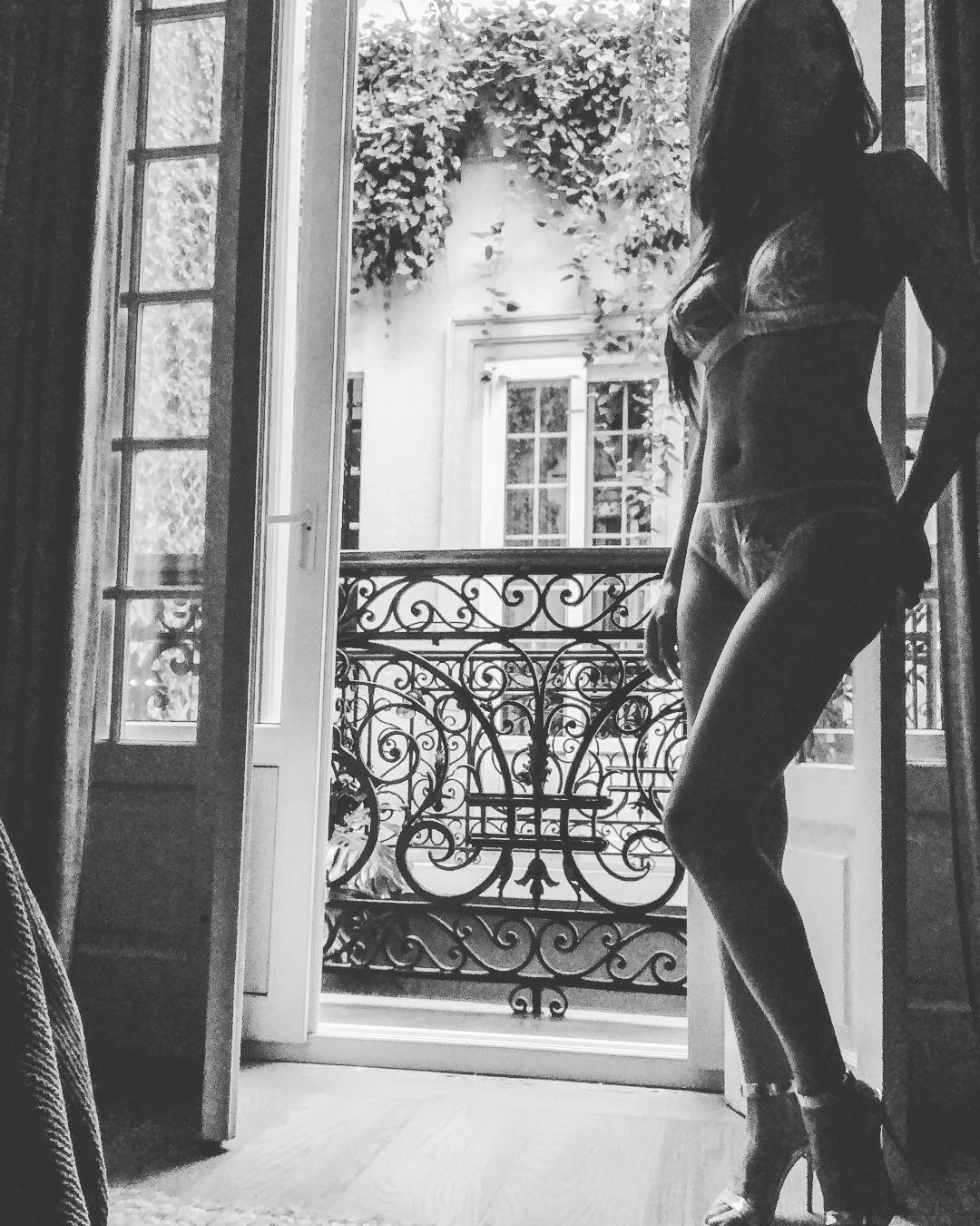 Vanessa Rallonza: Woman in Lingerie Posed by Window