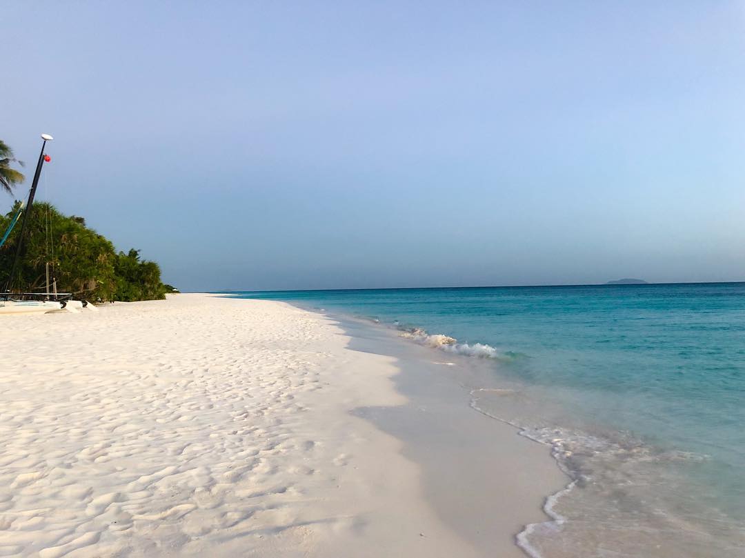 Vanessa Rallonza: Serene Seashore Sanctuary - Pristine Coastline and Azure Sea