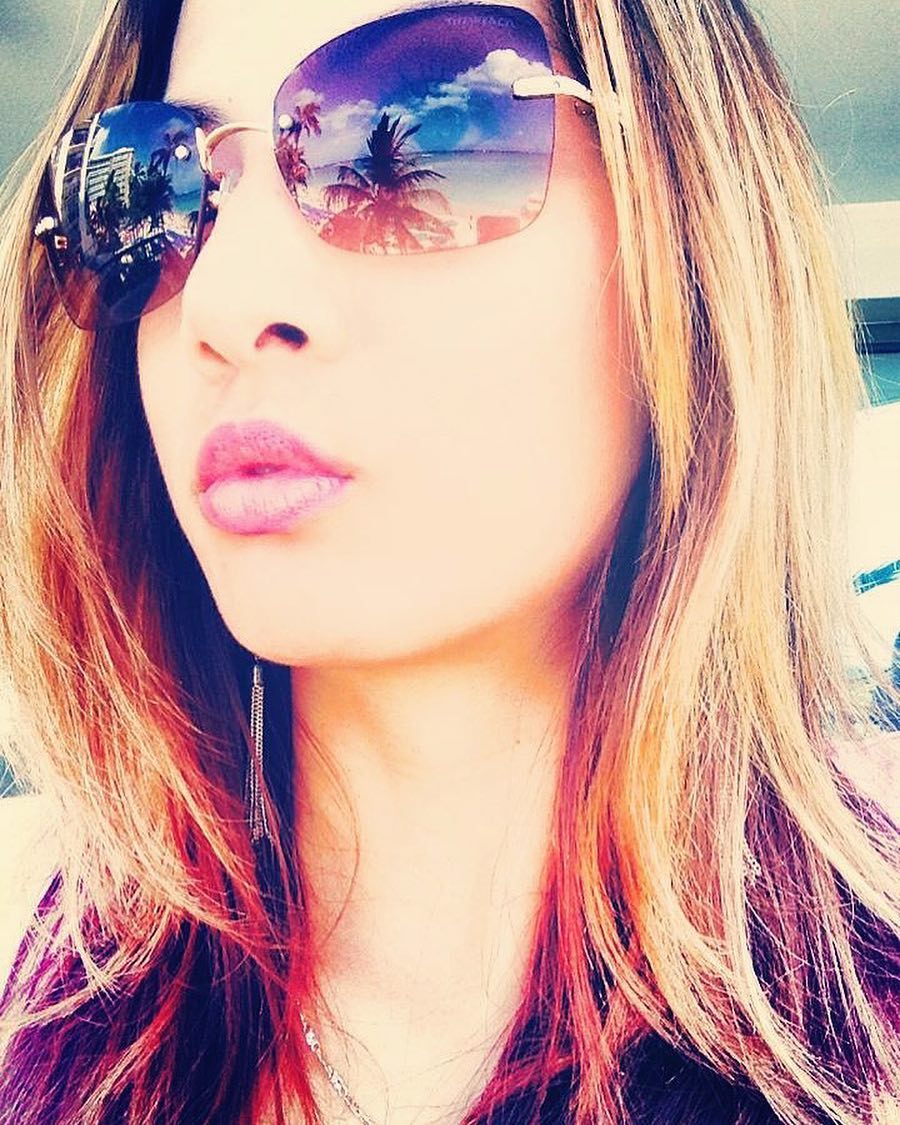 Vanessa Rallonza: Pink Top, Sunglasses, Frizzy Hair Flashback