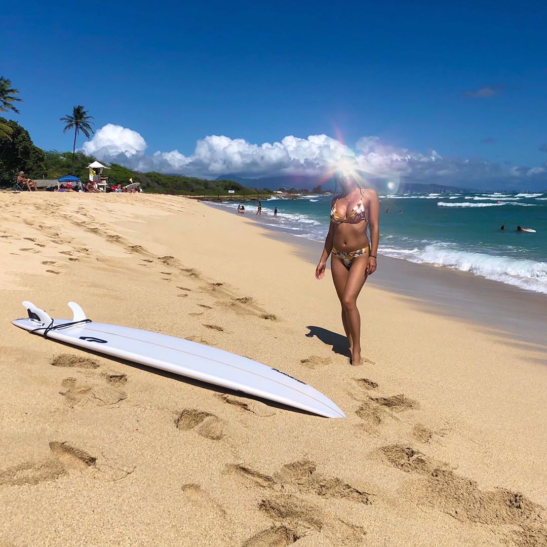 Vanessa Rallonza: Sun-Kissed Beach Bliss with Surfboard
