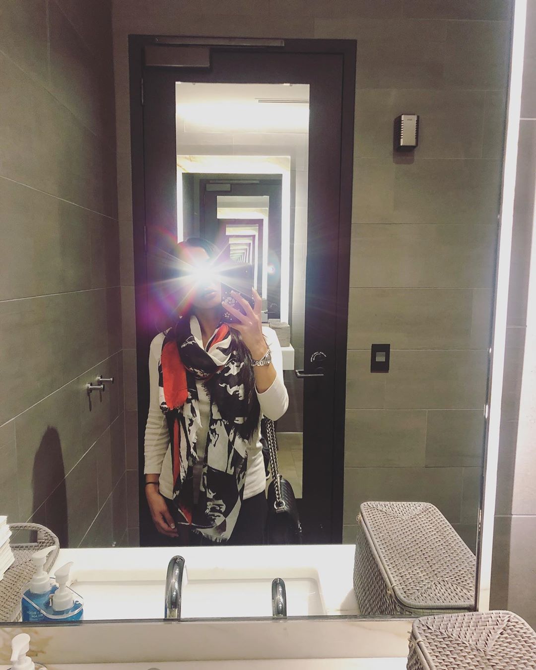 Vanessa Rallonza: Vibrant Selfie at Airport Mirror