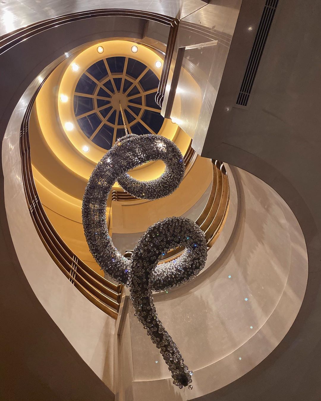 Vanessa Rallonza: Industrial Mythical Charm - Spiral Staircase with Metal Snake