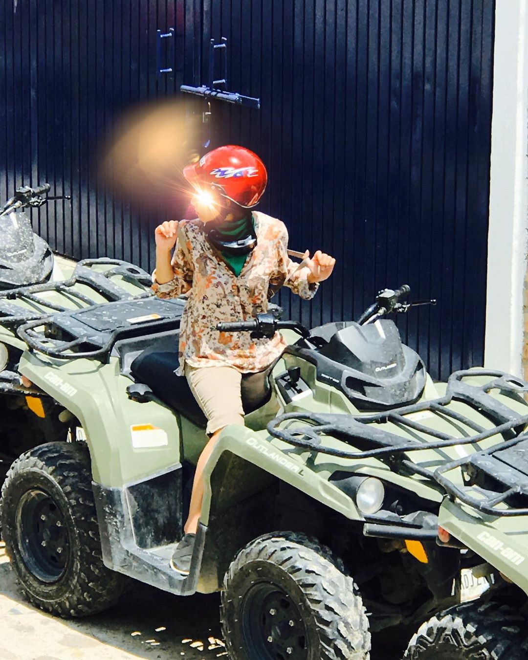 Vanessa Rallonza: Playful Grin on Scenic Terrain ATV Adventure