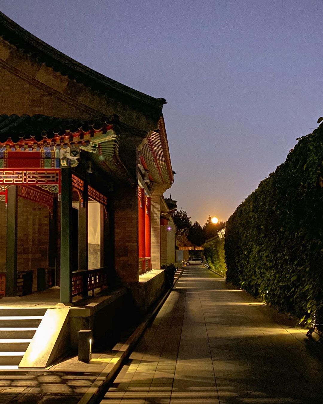 Vanessa Rallonza Approaches Moonlit Spa Tower at Dusk