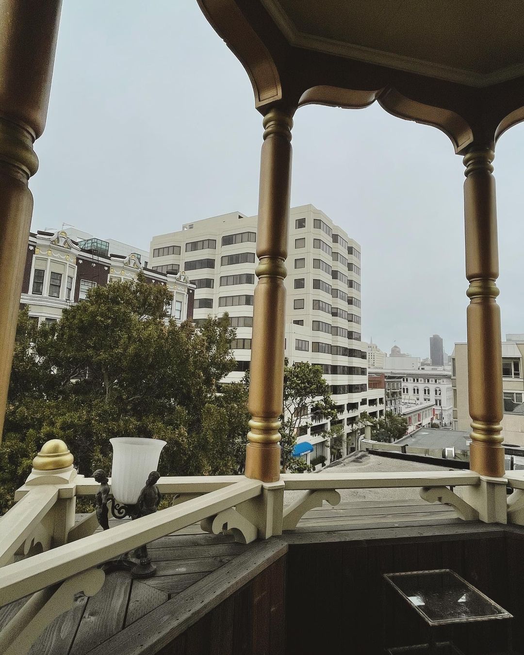 Vanessa Rallonza: Foggy Victorian Balcony Over San Francisco Skyline